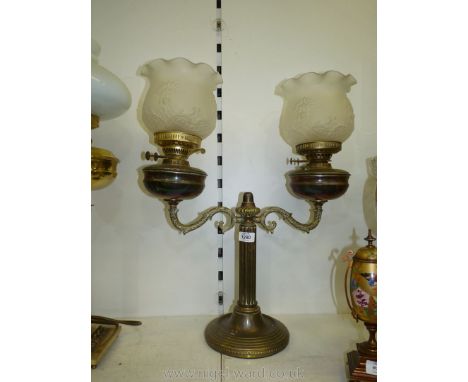 A brass twin Oil Lamp with frosted shade. 23 3/4" tall x 19" wide.