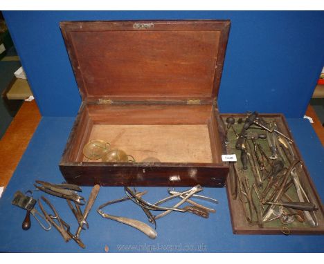 A wooden box containing vintage dental extracting tools, forceps and under shelf scales. 18" x 10 1/2".