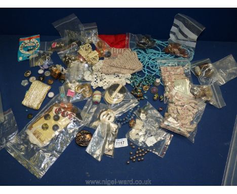 A quantity of vintage buttons, linen labels, beads, buckles etc.