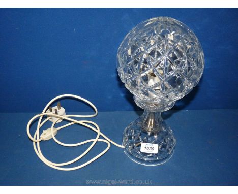 A cut glass lamp.