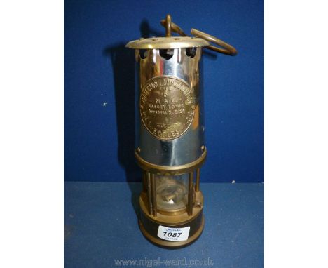 An Eccles metal and brass miners safety lamp, 'type 6', 9" tall.