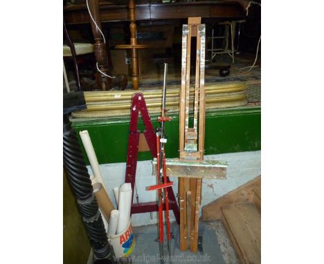 A large wooden easel, plus a smaller one in Burgundy colour and a metal easel.