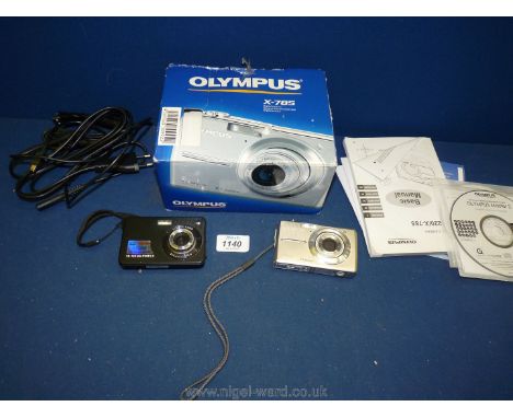 A boxed Olympus X-785 7.1 digital camera along with another 18 mega pixel digital camera.