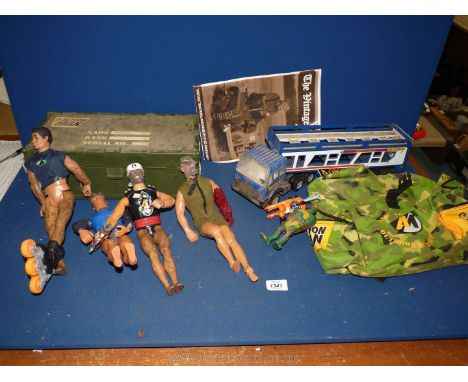 An Action Man case, four Action Men, Action Man equipment, etc.