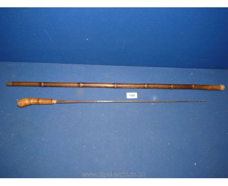 A cane handled sword Stick, 35'' long.