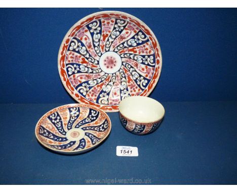 A Worcester first period tea bowl and saucer, painted and gilded in the Queen Charlotte pattern, Chinese style seal mark to b