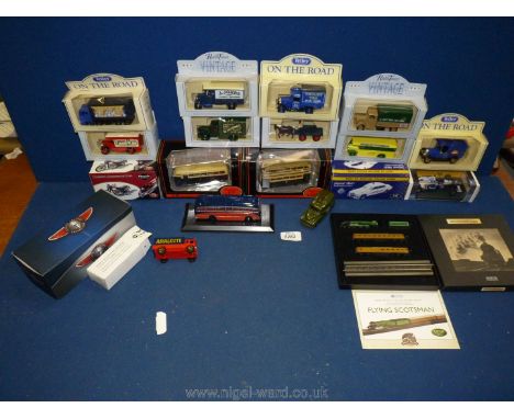 A quantity of boxed model vehicles including Tetley on The Road, Triumph Bonneville T120,, Radio Times vintage, buses, lorrys