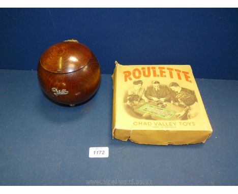 A 1930's style wooden tea caddy and Chad Valley Roulette game (possibly 1950's).