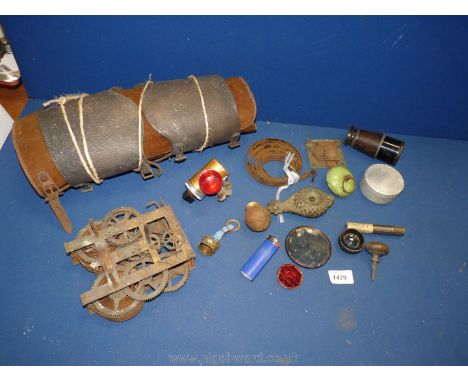 A box of vintage miscellanea including leather and suede gaiters, monocular, brass oil lamp and clock movement by Ansonia of 