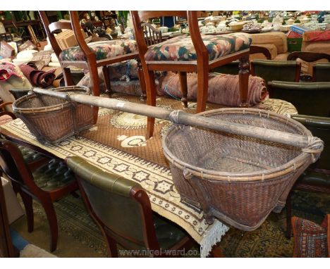 A vintage paddy-field yoke and carrying Baskets, 65" long.