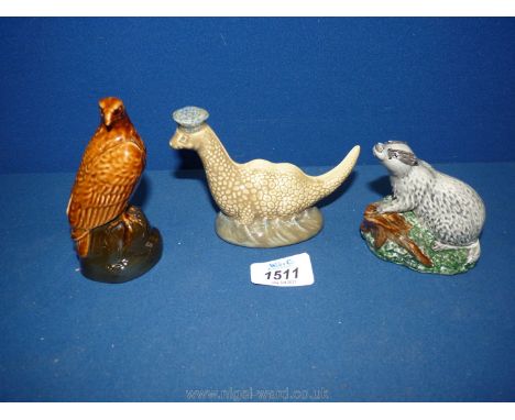 Three small Beswick decanters made for Beneagles Scotch Whiskey; 'The Lochness Monster', 'Badger' and 'Bird of Prey'.