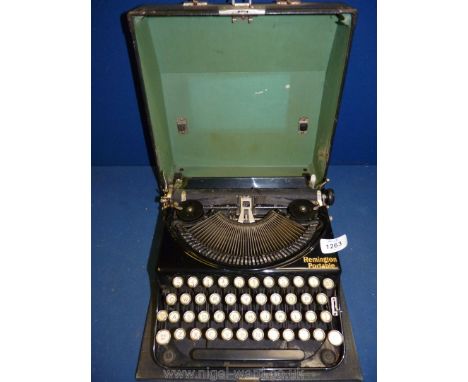 A cased Remington Portable typewriter.