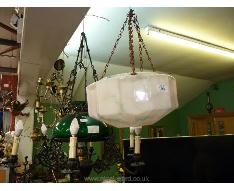 A vintage glass ceiling Lampshade in pink with blue marbling.