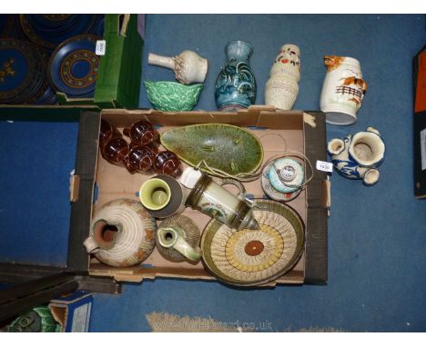 A quantity of pottery items including Jersey pottery cups, studio pottery ewers, table lamp etc..