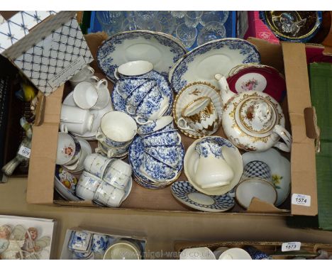 A quantity of tea and coffee ware including part blue and white Teaset, Royal Standard coffee cans, Royal Worcester 'Ribbons'