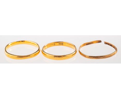 A group of three 22ct gold wedding bands, all UK hallmark, total gross weight 4.6grams, (3).(Note: one is a size K, one is sp