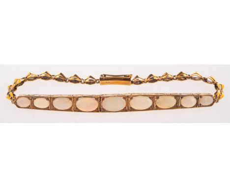 An Art Deco opal bracelet, nine graduated opal cabochons set in an articulated engraved setting, on a fancy-link bracelet, pu