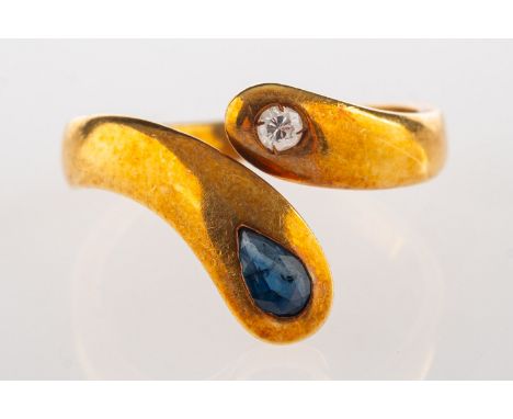 A sapphire and diamond snake ring, set with a brilliant-cut diamond and a pear-shaped blue sapphire, marked 750, size L1/2 to