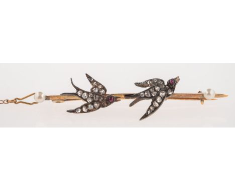 A Victorian double swallow brooch, each swallow is set with rose-cut diamonds and a single ruby cabochon eye, pearl to each t