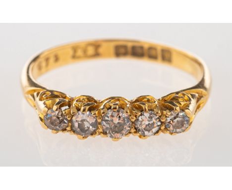 An 18ct gold five stone diamond ring, carved shoulders & gallery to five graduated claw set old-cut diamonds, diamonds approx