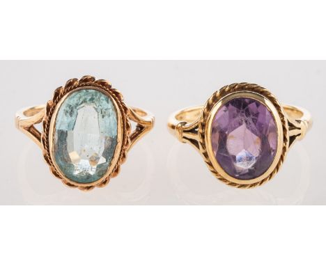 A group of two rope twist design rings, including a 9ct yellow gold rope twist ring set with an oval-cut amethyst, indistinct