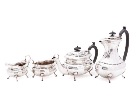 A George V silver four piece tea service by Viner's Ltd, Sheffield 1933, comprising tea pot, coffee pot, sugar basin and milk