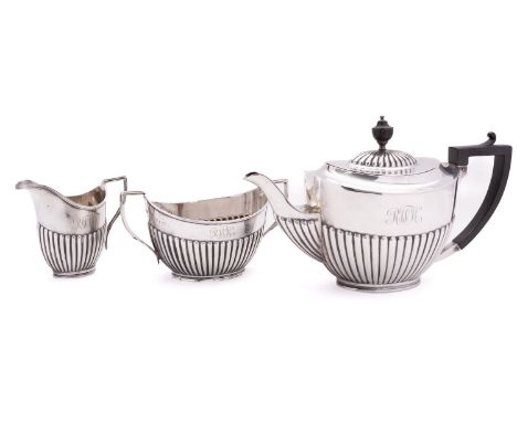 Military interest; a George V silver three piece tea service by Fordham & Faulkner (William Charles Fordham & Albert Buckley 