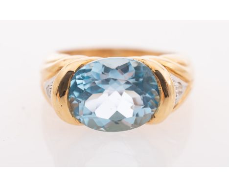 A vintage blue topaz and diamond ring, a cocktail ring set with an oval mixed-cut blue topaz, weighing approx. 4.98 carats, a