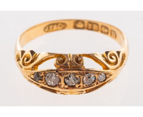 An Edwardian 18ct gold diamond ring, set with five old-cut diamonds in an openwork scroll setting, UK hallmark, size H, 1.9gr