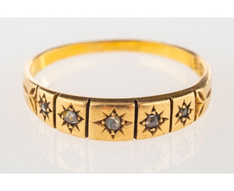 An 18ct gold Victorian five stone ring, star set with five small rose-cut diamonds, UK hallmark, Birmingham, 1897, size O1/2,