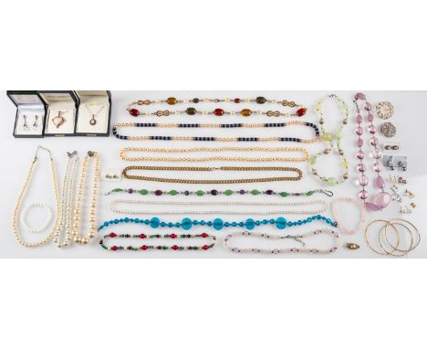 A mixed group of costume jewellery, to include brooches, bangles, earrings, bead necklaces, faux pearls, some semi-precious b
