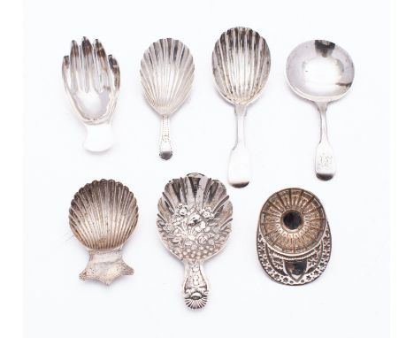 A collection of seven silver tea caddy spoons; including a William IV Fiddle pattern spoon with shell bowl by John Osment, Ex