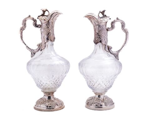 An Elizabeth II glass and silver claret jug by M.C, Sheffield 1998, in the Victorian style, the cast grape finial set on a sh