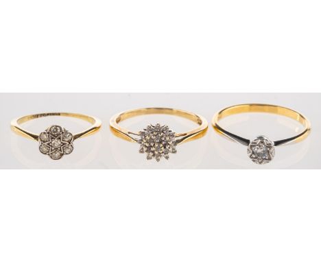 A group of three diamond rings, including a single stone ring illusion set with a brilliant-cut diamond, marked 18ct, size P,