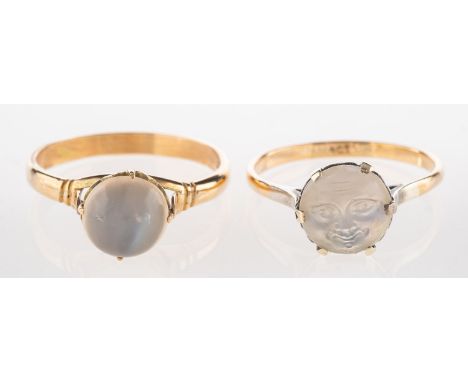 A carved 'man on the moon' moonstone ring and one other ring, including a claw set carved moonstone ring depicting a smiling 