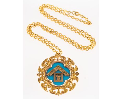 A 9ct gold Masonic pendant, ornately designed with Masonic emblems on a blue background, engraved to verso ' Presented by the