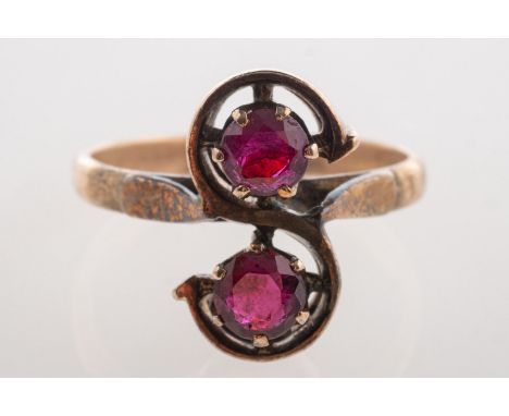 A two stone ruby ring, set with two circular-cut rubies, rubies approx. 0.50 carat total, marked 14ct, size L, 3.3grams.