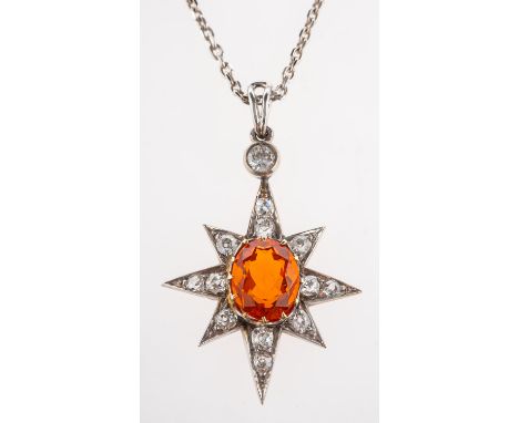 A fine fire opal and diamond pendant with chain, a star-shaped pendant, claw set to the centre with an oval mixed-cut fire op