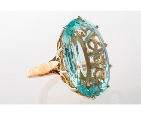 A French mid-century aquamarine cocktail ring, set with an oval-mixed cut aquamarine, approx. 26.50 carats, in a claw and ope