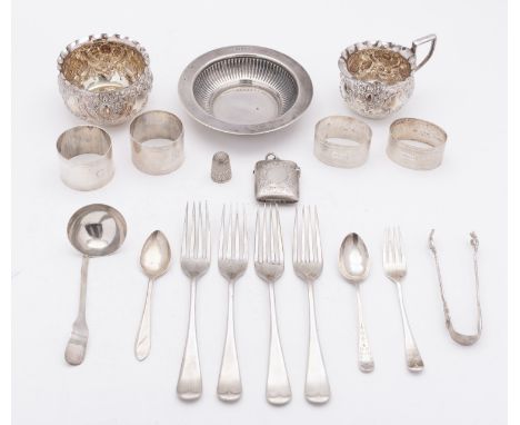 A mixed group of silver; including a silver cream jug and sugar bowl, London 1897, a small circular part reeded dish, a silve