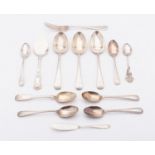 A mixed group of silver flatware; including three Old English dessert spoons, London 1927,