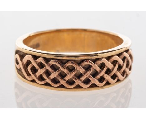 Clogau.  A 9ct yellow & rose gold ring, with a Celtic design to the front, UK hallmark, size M to M1/2, 4.7grams, accompanied