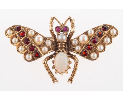 An insect brooch, in the form of a butterfly, set with an oval-cut opal cabochon, circular-cut garnets, pearls & two circular