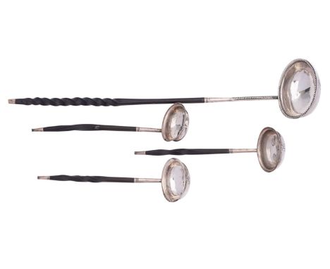 A George III silver punch ladle by Thomas Morley, London 1780, plain oval with a part twisted baleen handle, 34cm (13 1/2in) 