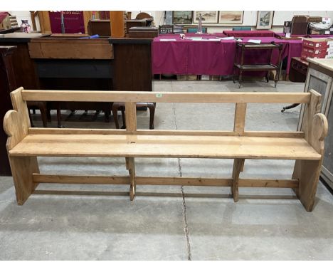 A pine pew, 84" long.