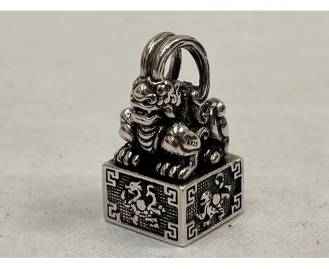A Chinese silver and yellow metal seal.