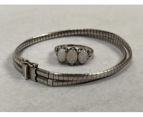 A silver three stone opal ring and a double silver bracelet.