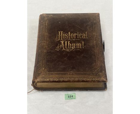 A Victorian leather bound photograph album with integral music box playing an air. 11½" high.