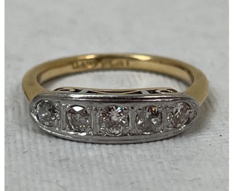 A five stone diamond ring. In gold marked 18ct. 4g gross, size P.