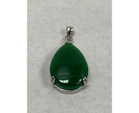 A jade and white stone pendant.